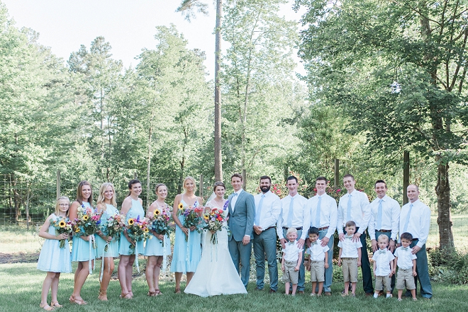 Great photo of the bride and groom and their wedding party after the ceremony!
