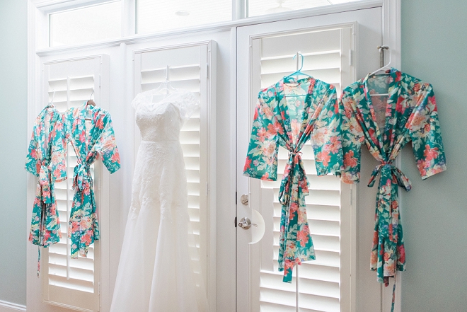 Such a darling shot of this Bride's wedding dress and Bridesmaid's robes!