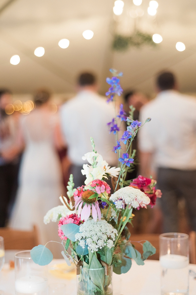 We're loving these wildflower handmade centerpieces at this reception!