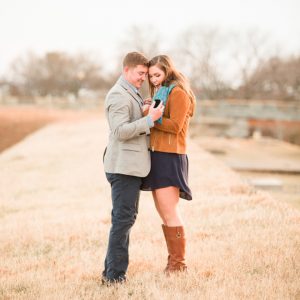 Gorgeous shot of a proposal in a stunning field by Corrin Jasinski Photography