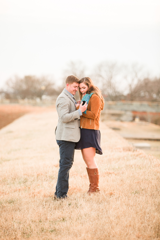 Gorgeous shot of a proposal in a stunning field by Corrin Jasinski Photography