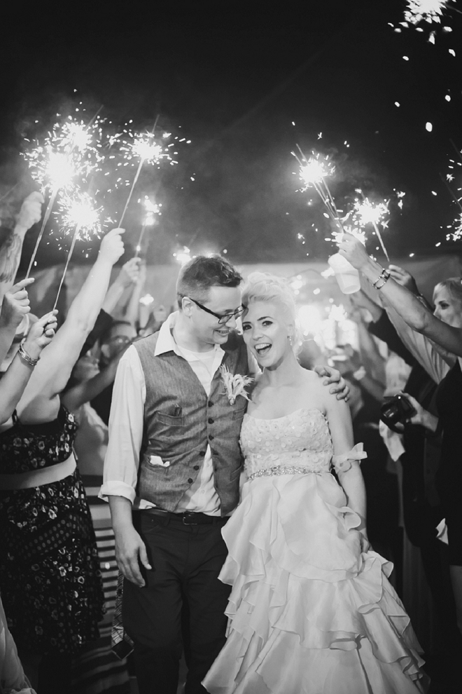 The Mr. and Mrs. leaving their wedding through a sparkler exit!