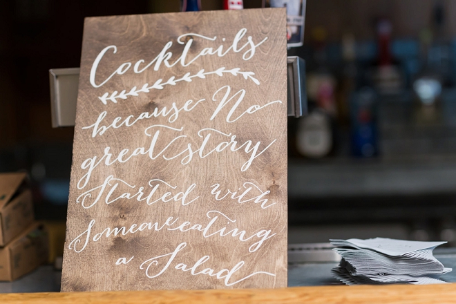 We're loving this couple's wooden calligraphy signs at their reception!