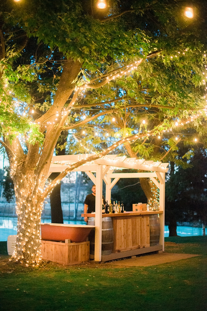 How gorgeous is this couple's bar?! Twinkle lit and beautiful!