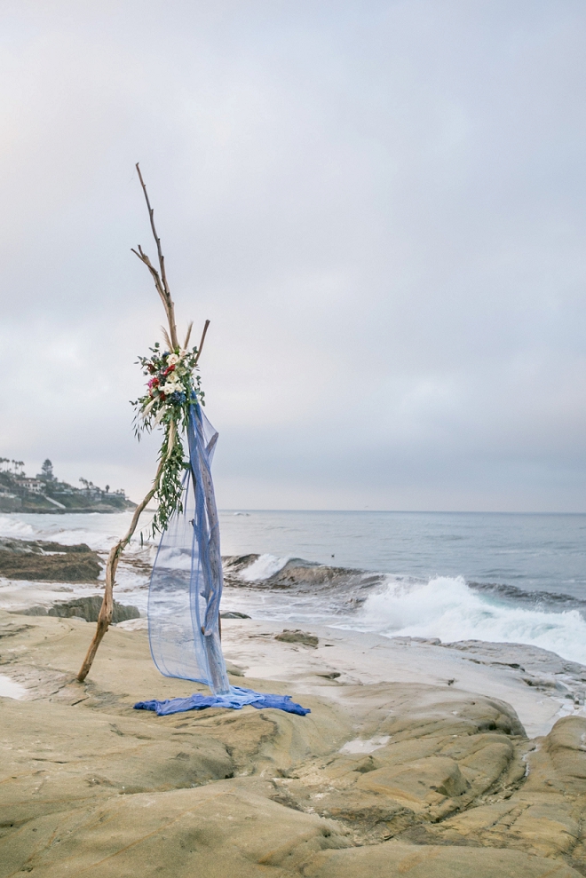 We're in LOVE with this stunning styled ceremony tee pee at this styled beach wedding!
