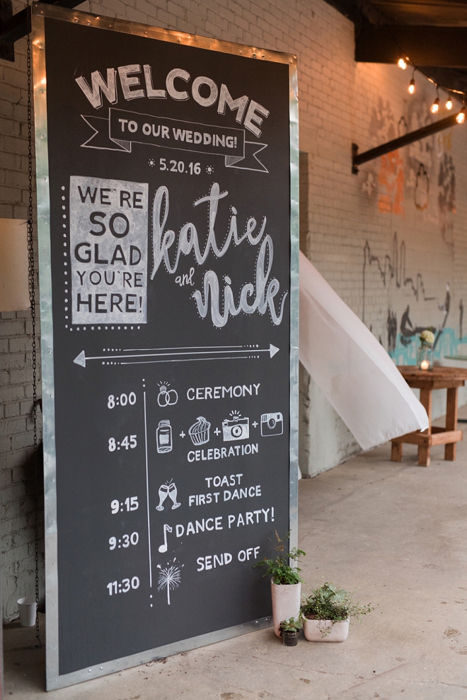 We love this hand lettered welcome chalkboard sign!
