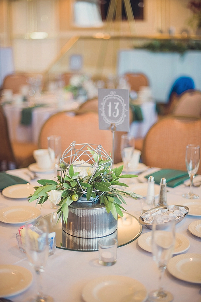 We love the clean and modern centerpieces and table numbers at this stunning affair!