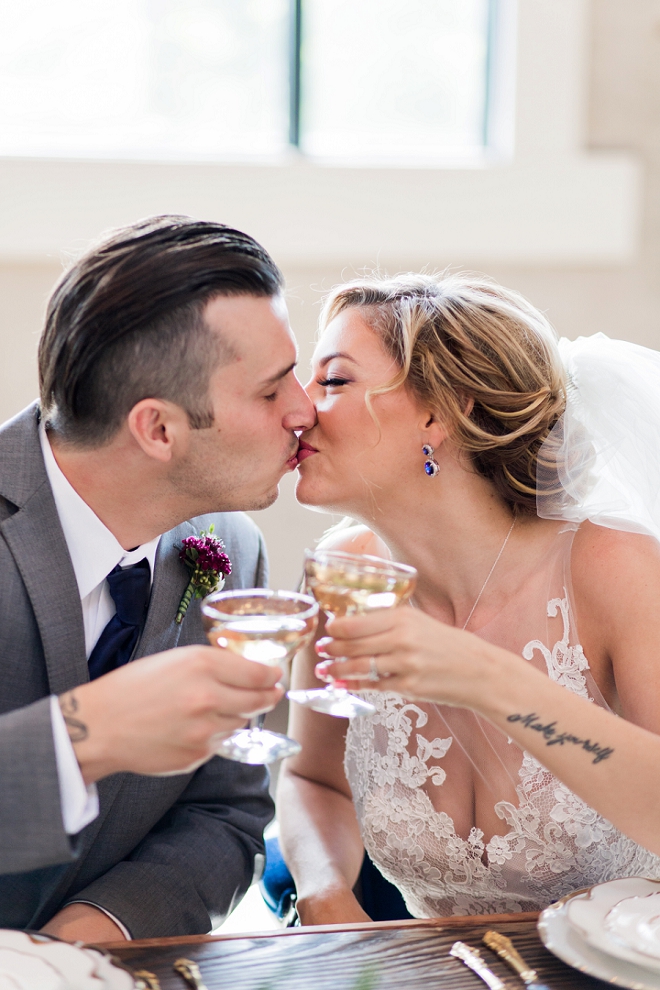 Champagne and kisses for this Mr. and Mrs. at their stunning styled wedding!