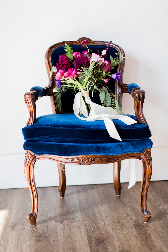 We couldn't be more in love with this gorgeous blue chair or the stunning bouquet!