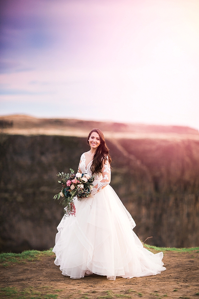 We are in LOVE with this Bride's long sleeved wedding dress and bouquet at her styled anniversary shoot!