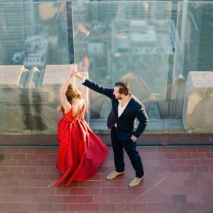 Try dancing on top of the world for your engagement photos.