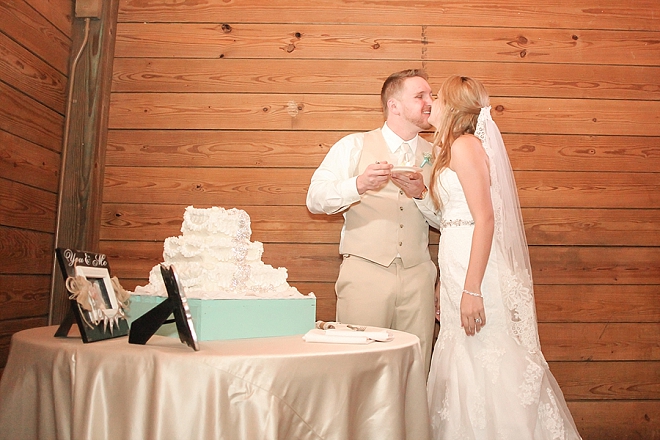 We love this darling couple cutting the cake at their reception!