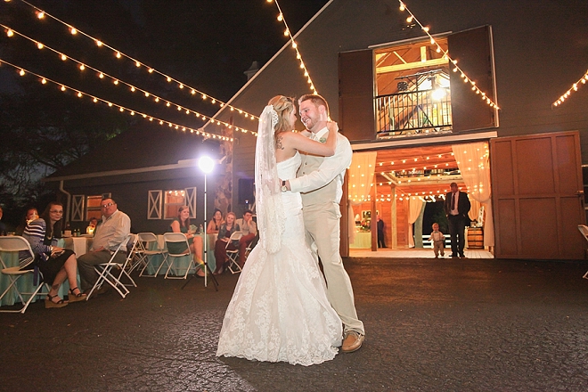 First dance as Mr. and Mrs. under the twinkle lit sky at this stunning barn wedding!