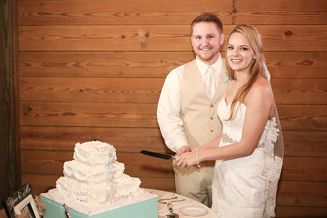 We love this darling couple cutting the cake at their reception!