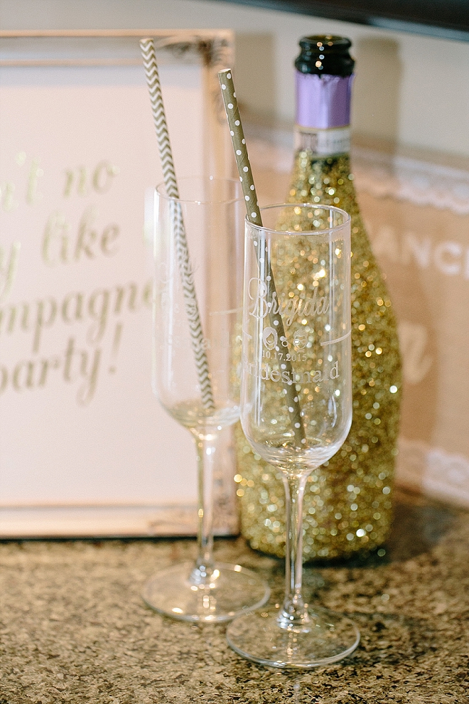 Check out these adorable etched champagne glasses and glitter bottles the bride made for her big day!