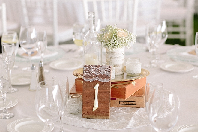 We love these gorgeous wooden and lace table numbers at this gorgeous reception!