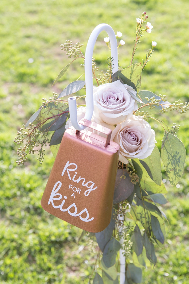 You have to see this adorable DIY ring for a kiss cowbell, perfect for a garden wedding!