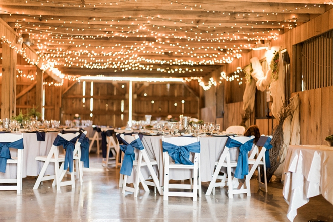 Love the navy and pops of gold and green at this couple's twinkle lit reception!