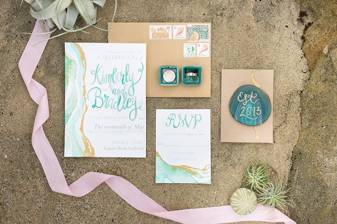 We're in love with this turquoise watercolor invitation suite!