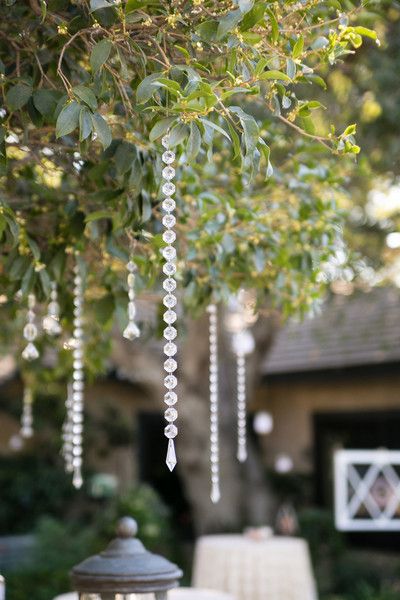 Romantic hanging beads from a tree - outdoor wedding ideas.