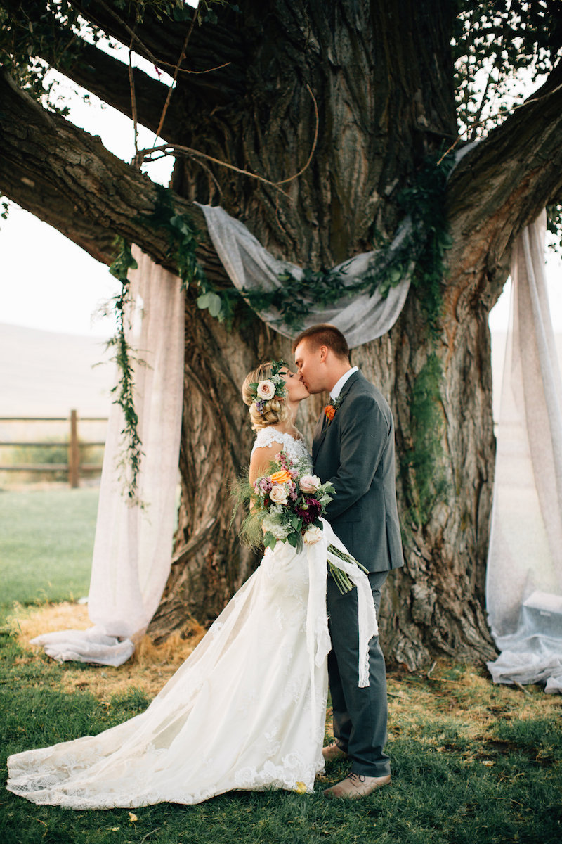 This fabric draping on the tree is such a simple way to decorate your wedding.
