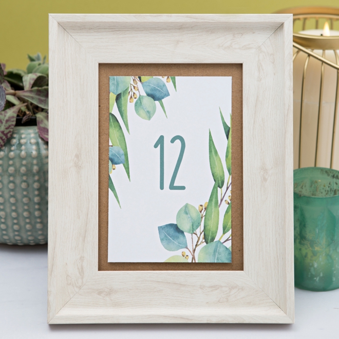 Darling free printable table numbers with a eucalyptus theme!