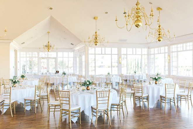 We love this reception with this delicate gold and greenery style!