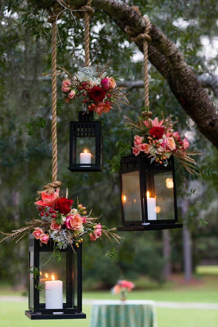 Love these lanterns combined with flowers for our spring wedding.