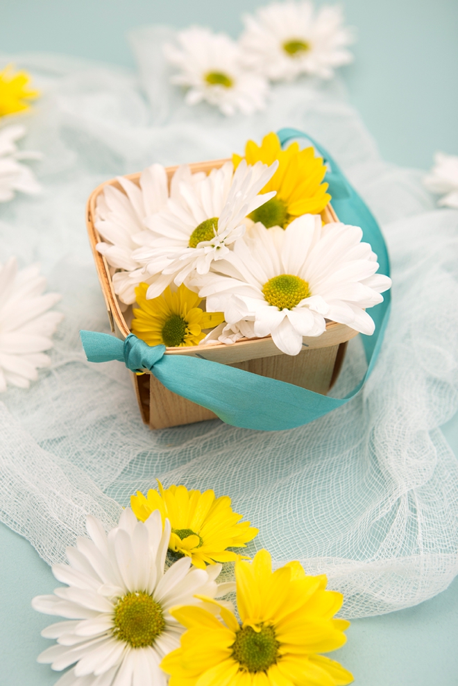 Have your flower girl toss daisy heads instead of petals!