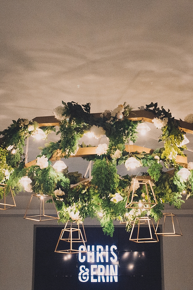 Check out this stunning signage and modern greenery chandelier!