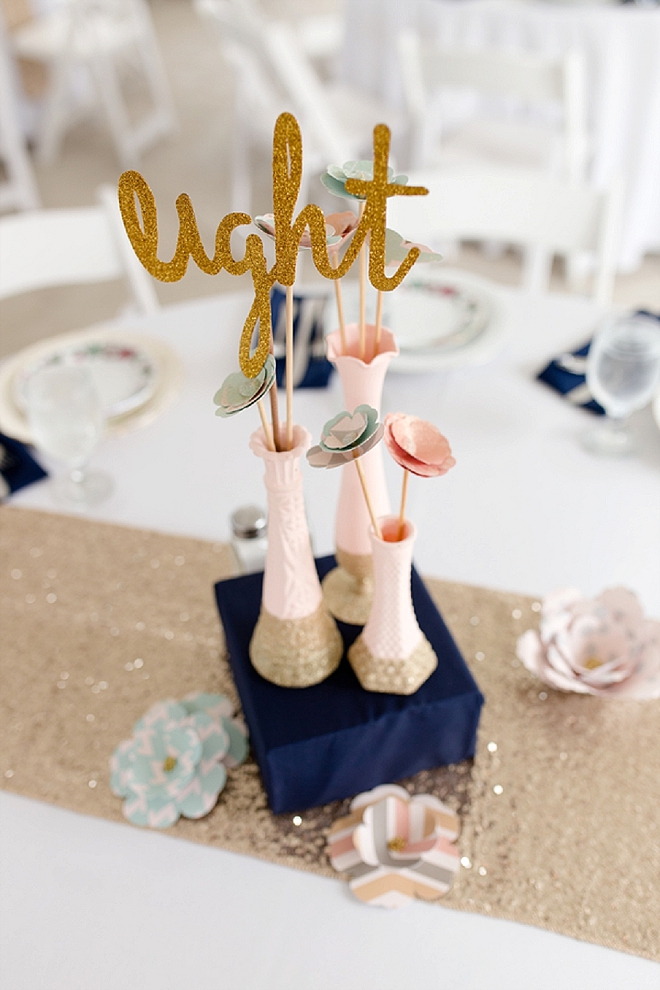 We're LOVING these gold glittery table numbers the Bride crafted!