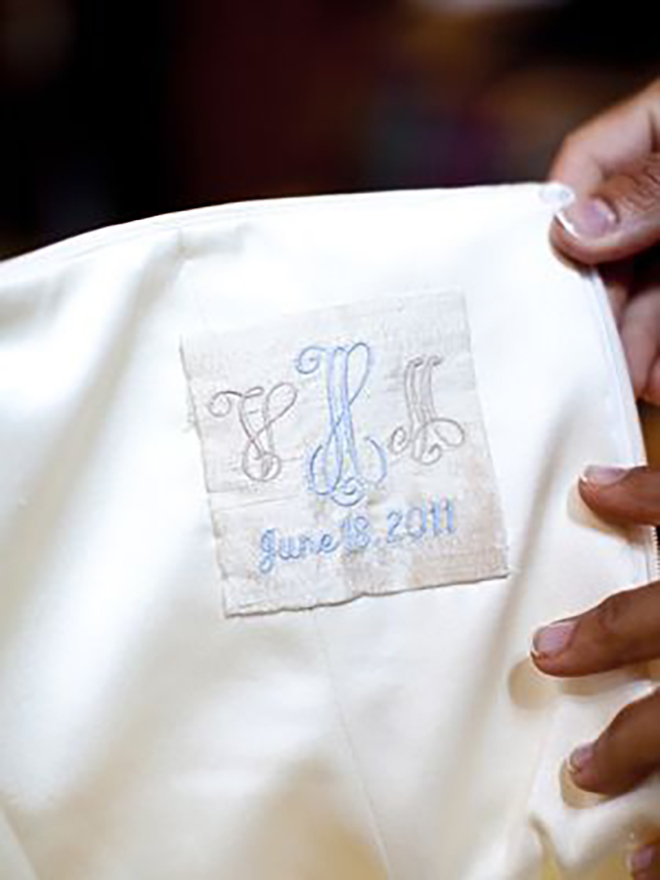 The inside of your gown is such a precious and personal place to add your wedding logo. 