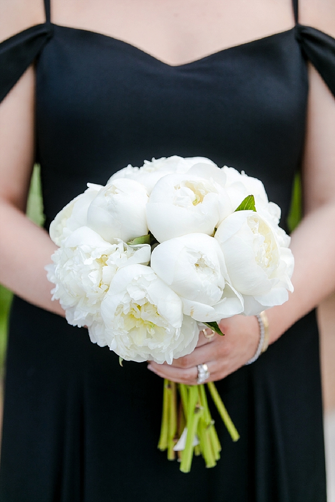 Loving these classic black bridesmaid's dresses with all white bouquets!