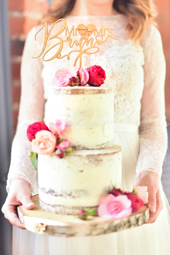 Swooning over this gorgeous naked wedding cake with customized wooden cake topper!