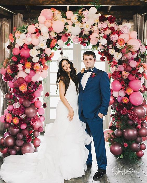 OMG this wedding balloon arch is INSANE! Love the jewel tones and the gorgeous bride.