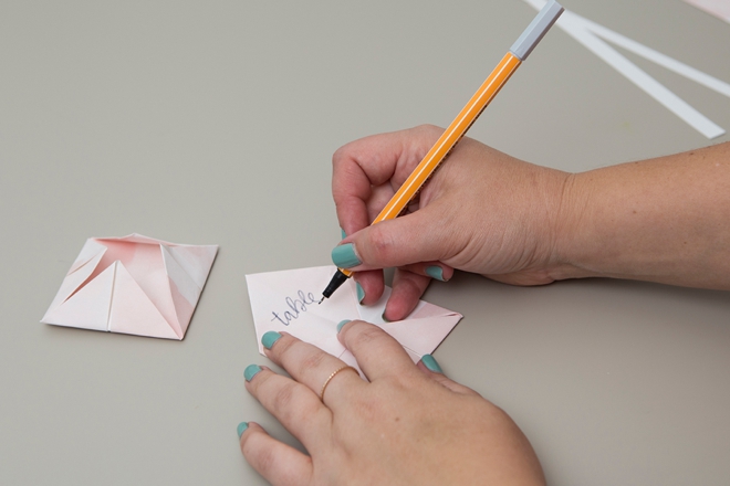 DIY cootie catcher seating cards for the win!