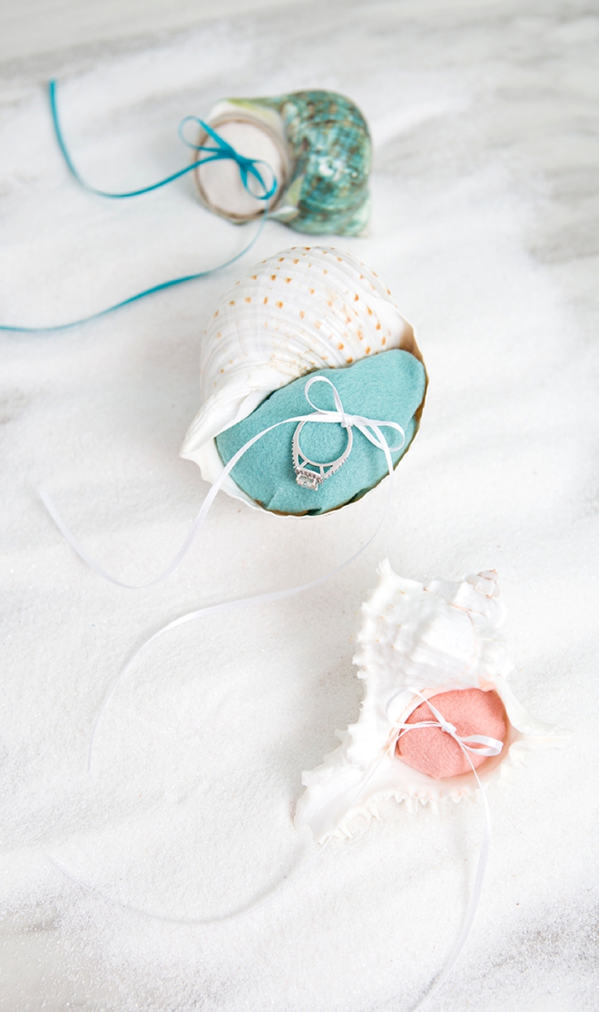 These little DIY felt seashell ring bearer pillows are perfect for your beach wedding!