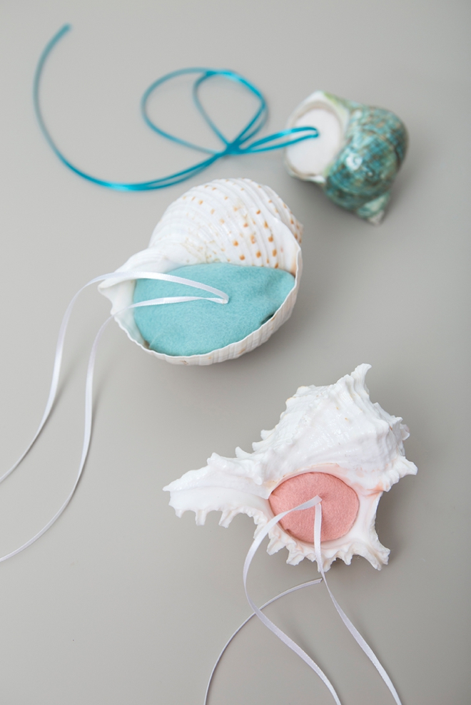 These little DIY felt seashell ring bearer pillows are perfect for your beach wedding!