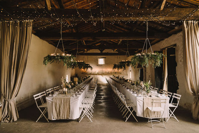 Folding chairs make a simple stunning statement at a wedding.
