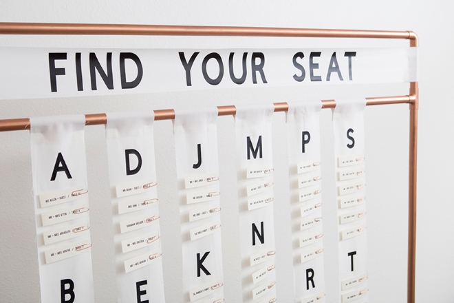 This DIY copper pipe seating card display is seriously awesome!