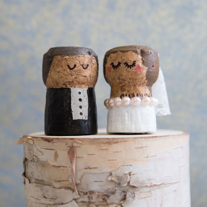 OMG, these DIY champagne cork bride and groom cake toppers are the cutest thing ever!