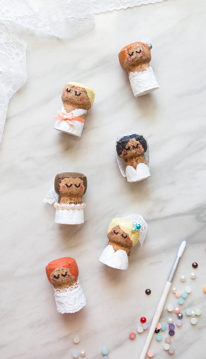 OMG, these DIY champagne cork bride and groom cake toppers are the cutest thing ever!