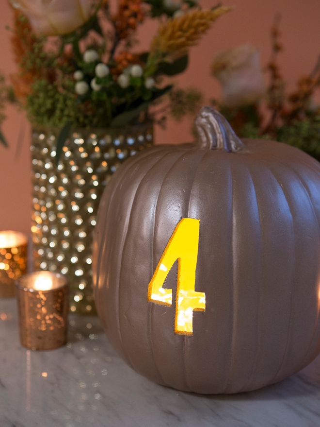 These DIY faux pumpkin table numbers would be perfect for a fall wedding!