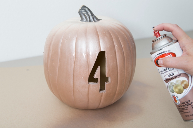 These DIY faux pumpkin table numbers would be perfect for a fall wedding!