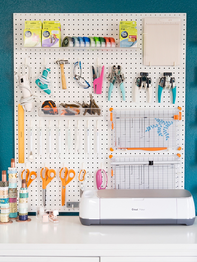 Wow, this peg board tool wall and Cricut station is amazing!