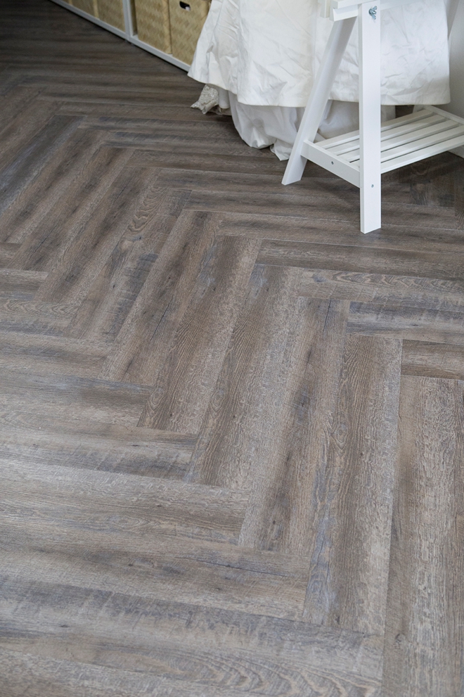 This herringbone peel and stick floor is amazing!