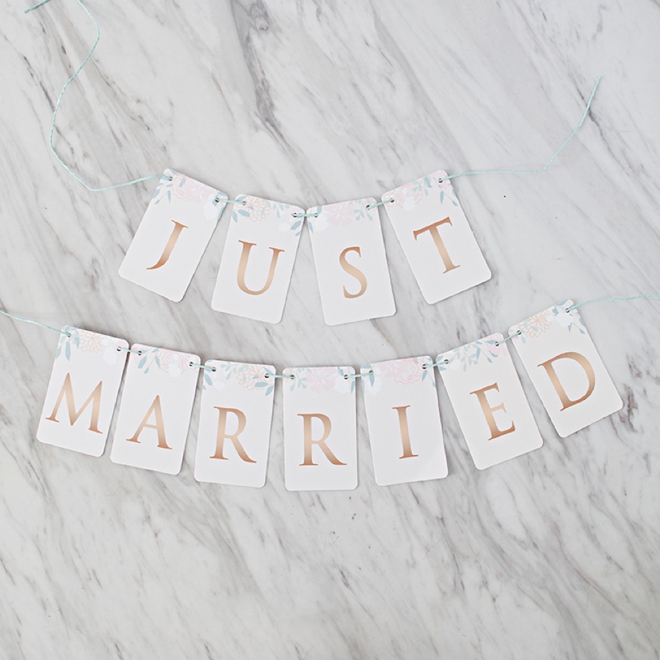 Free printable Just Married banner with a floral design and rose gold letters!