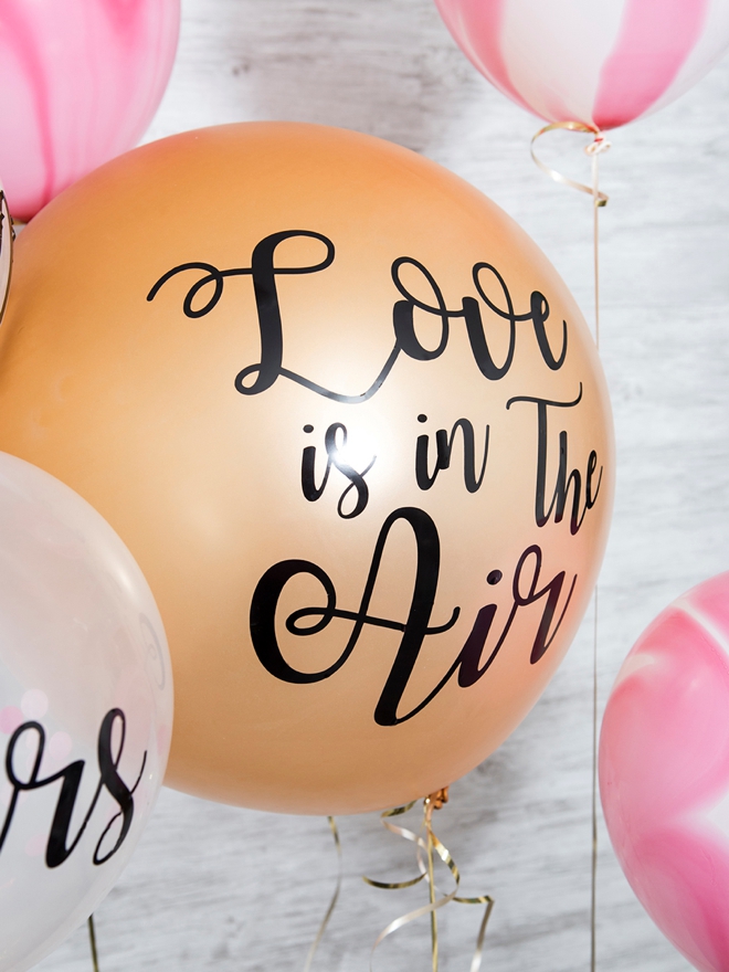 Learn how to make your own custom wedding balloon signs!