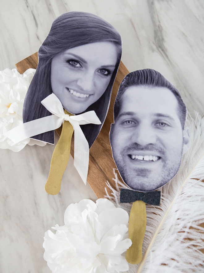 Make photo paddles to use during the wedding shoe game instead of shoes!