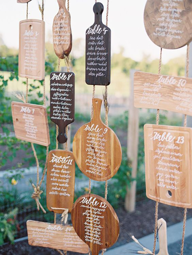 Calligraphied cutting boards make a fabulous seating display